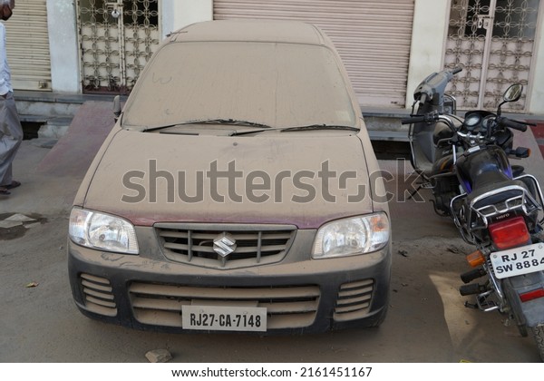 Car with dirt And dirt on\
the surface of the car paint and car glass, the concept of car\
care. Extremely dirty. Dirty side. Element of design. Udaipur India\
May 2022