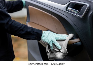 Car Disinfecting Service. Woman Disinfecting And Cleaning The Inside Handle Of The Car Door. Safety And Preventing Infection Of Covid-19 Virus, Contamination Of Germs Or Bacteria, Wipe Clean Surfaces