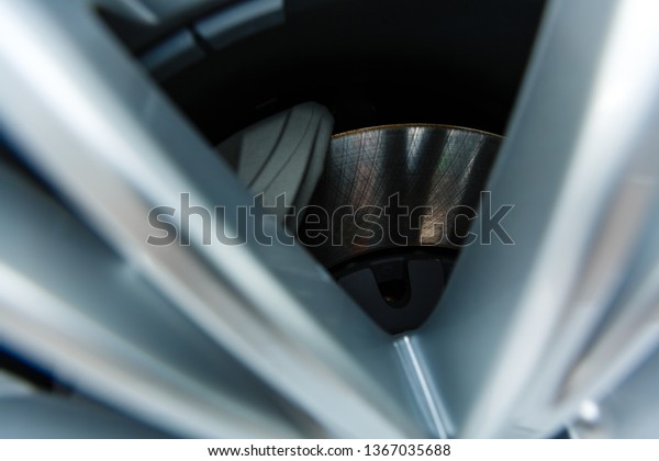 Car
disk brake. Steel brake disc complete with brake
pads