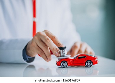 Car Doctor With Stethoscope In A Car Showroom