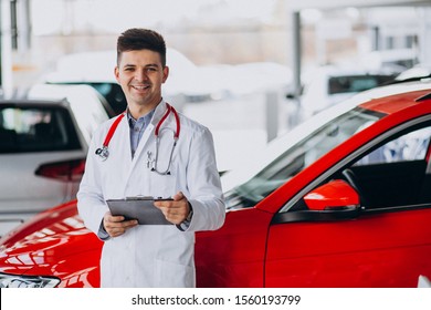 Car Doctor With Stethoscope In A Car Showroom