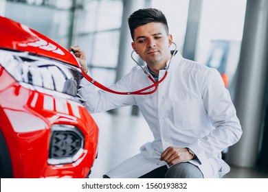 Car Doctor With Stethoscope In A Car Showroom