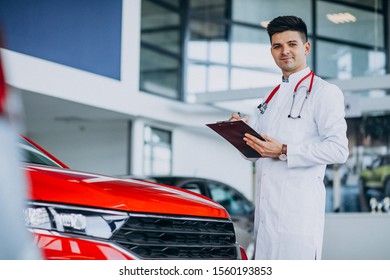 Car Doctor With Stethoscope In A Car Showroom