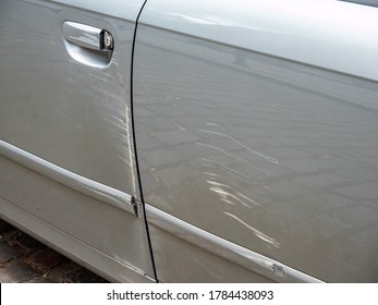 Car Door Detail With Scratches In The Paint