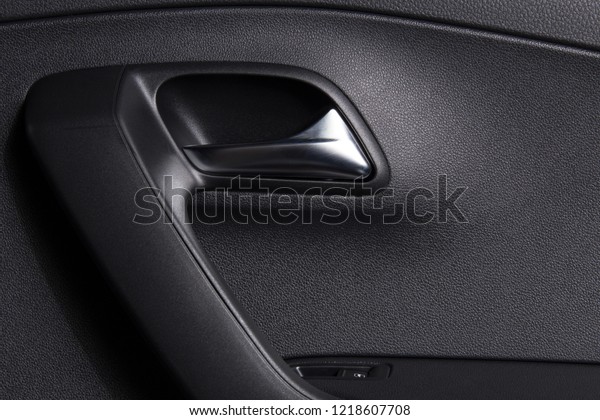 Car door handle inside. Clean car interior.\
Background for car cleaning\
themes.
