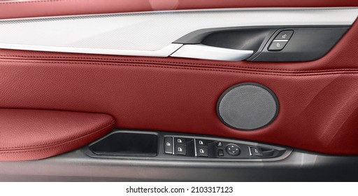 Car Door Handle Inside The Luxury Modern Car With Red Leather. Switch Button Control. Modern Car Interior Details. Red Perforated Leather