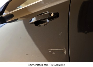 dented scratched car door