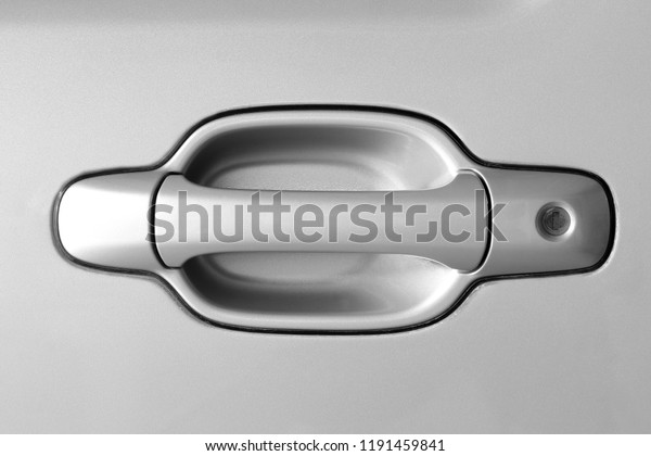 Car\
door handle of silver. Handle for opening car\
door
