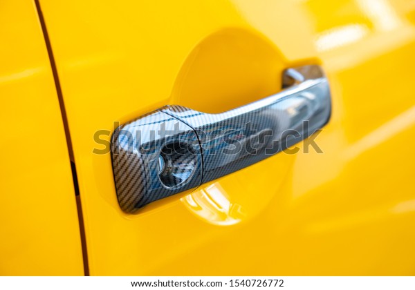 Car\
Door Lock and Handle. Yellow color.\
Transportation.