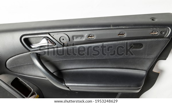 Car door trim with black leather upholstery on a\
white isolated background for repair and replacement in a car\
service. Spare parts\
catalog.