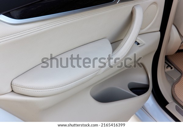 car door with white\
leather interior