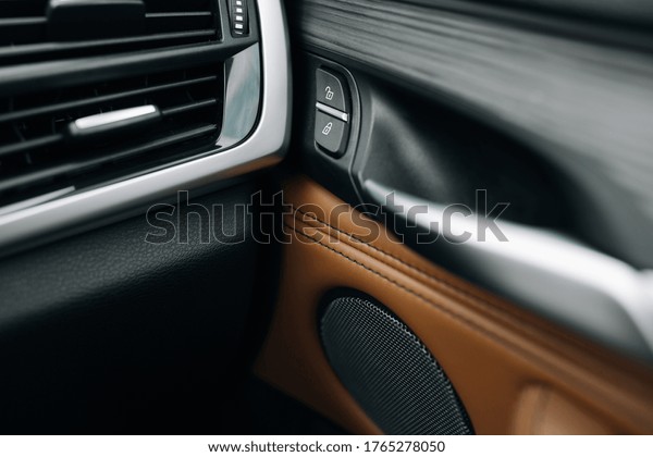 Car doors lock buttons close\
up