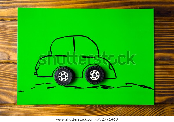 Car drawn on\
paper