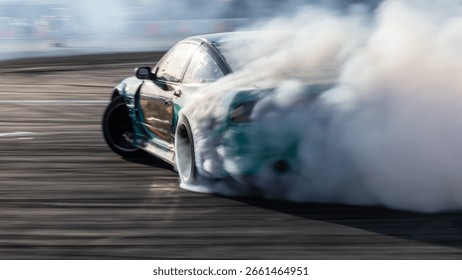 Car drifting, Blurred image diffusion race drift car with lots of smoke from burning tires on speed track, Car drifting on speed track, Professional driver drive drifting car.
