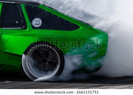 Car drifting, Blurred image diffusion race drift car with lots of smoke from burning tires on speed track, Car drifting on speed track, Professional driver drive drifting car.