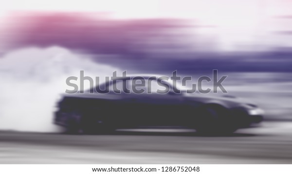 Car drifting,\
Blurred of image diffusion race drift car with lots of smoke from\
burning tires on speed\
track
