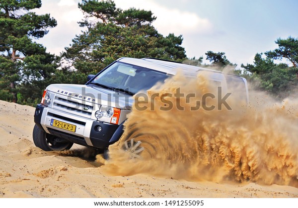 Car drifting in loose sand making a wave\
of sand.\
(23/05/2010 - Budel, The\
Netherlands)