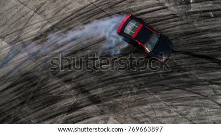 Car drifting, Drifting car on race track with smoke, Abstract texture and background black tire tracks skid on asphalt road, Wheel tire tracks background, Car tire track skid mark on race track.