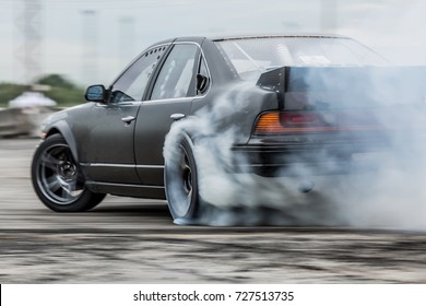 Car drifting, Sport car wheel drifting and smoking on track. - Shutterstock ID 727513735