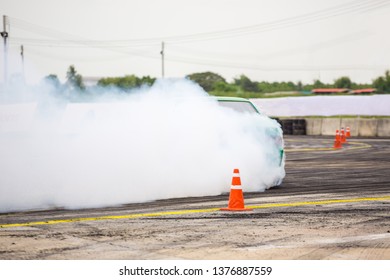 Car drifting, Car wheel spinning with smoke coming from wheels, Drag Racing on speed race track,