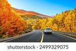 car drive on autumn road in beautiful nature. autumn colors in beautiful mountain road landscape. autumn landscape on the highway in forest. nature trip in fall. Autumn panorama on highway landscape.