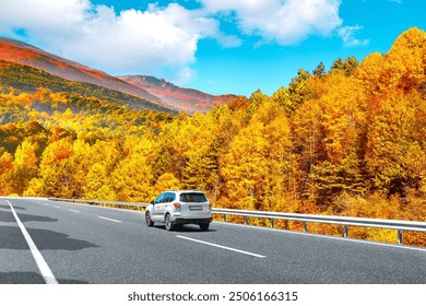 car drive on autumn road in beautiful nature. autumn colors in beautiful mountain road landscape. autumn landscape on the highway in forest. nature trip in fall. Autumn panorama on highway landscape. - Powered by Shutterstock