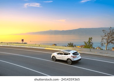 car drive on the road of Mediterranean beach. Highway view on coast on way to summer holiday. driving on coast of France. Europe travel trip in blue sea coast road landscape. holiday journey on sunset - Powered by Shutterstock