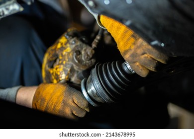 car drive shaft repair, CV joint and boot installation. - Shutterstock ID 2143678995