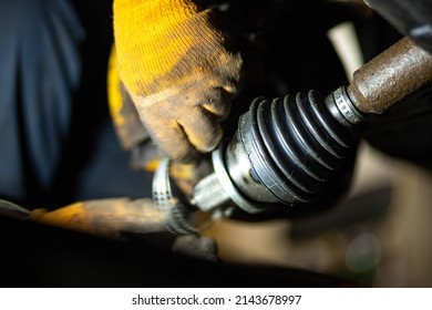 car drive shaft repair, CV joint and boot installation. - Shutterstock ID 2143678997