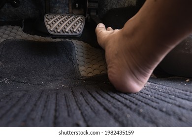 Car Driver Step On The Gas Pedal With Bare Feet.