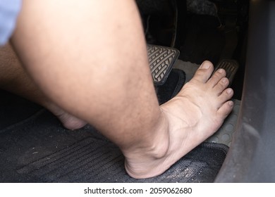 Car Driver Step On The Gas Pedal With Bare Feet.