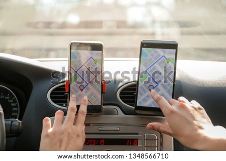 Car driver using mobile phones for navigation
