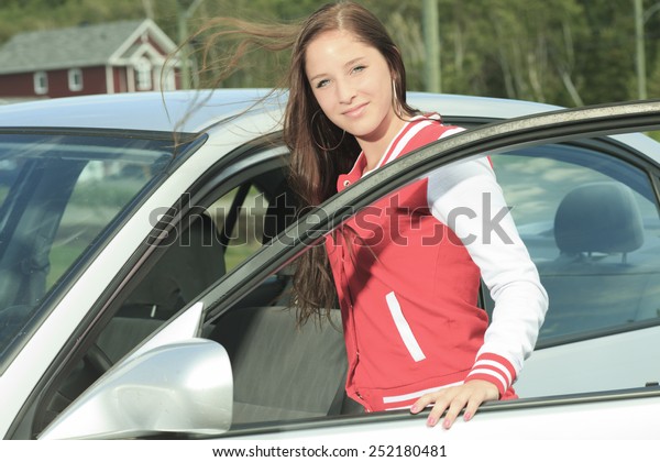 Car driver
woman happy showing car keys out
window