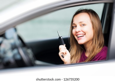 Car Driver Woman Smiling Showing New Car Keys And Car.