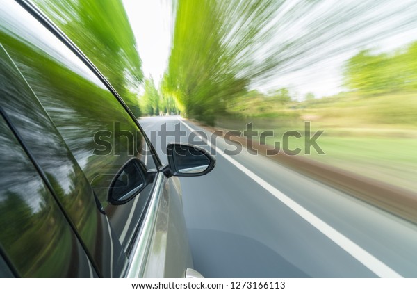 car driving with
country road motion blur