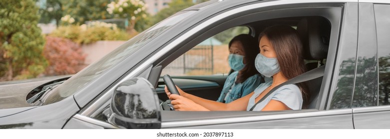 Car Driving Driver Woman Wearing Face Mask With Passenger Sitting In Front. Asian Family Road Trip Vacation Banner Panoramic.