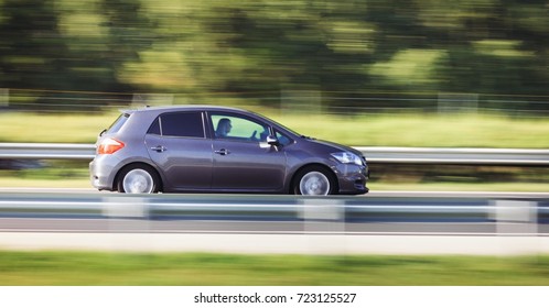 Car Driving Fast Motion On Highway Side View