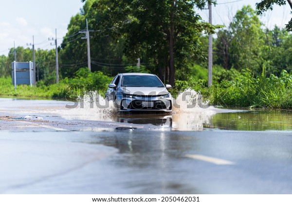 Car driving flood water, Some of the flooded\
area in thailand