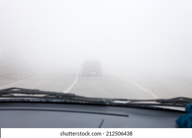 Car driving the Fog Road