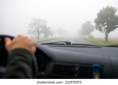 Car Driving In The Fog Road