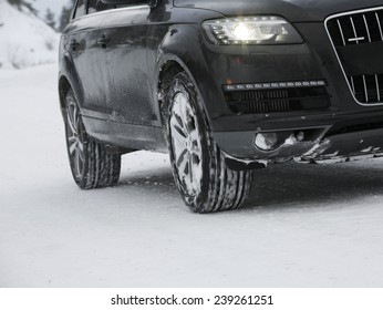 Car Driving In Forest With Much Snow
