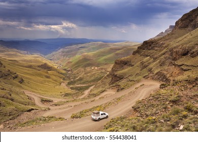 A car driving the hairpin turns of the Sani Pass on the border of South Africa and Lesotho.