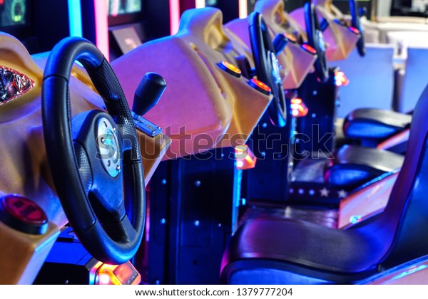 Car driving machines at arcade\
games in the entertainment zone in shopping center\
Photo