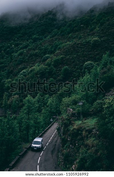 Car driving in\
mountains