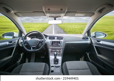Car driving on an asphalt blurred road