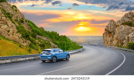 car driving on beautiful road in colorful sunset landscape in summer. Nature scenery on coastline highway. Europe travel trip in sea coast road landscape. summer vacation journey on road at the beach.