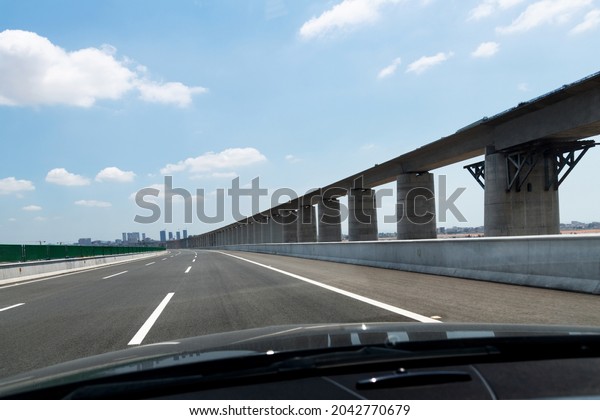 Car driving on bridge\
highway road.