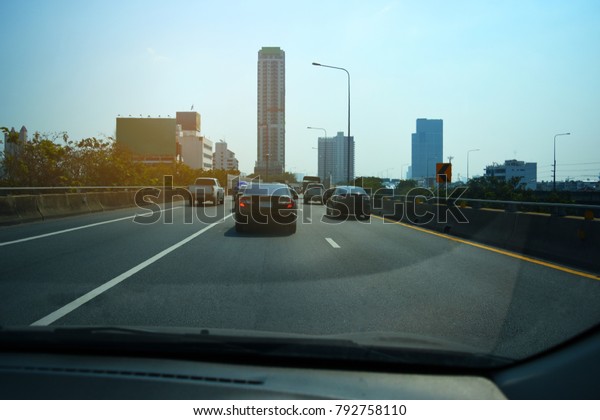 Car driving on\
high way road at sunset,Cars on the stretched road and The road\
leading to the eye,Car on\
road