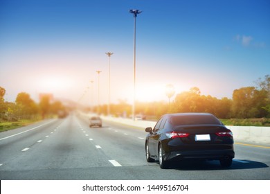 Car Driving On Road And Small Passenger Car Seat On The Road Used For Daily Trips