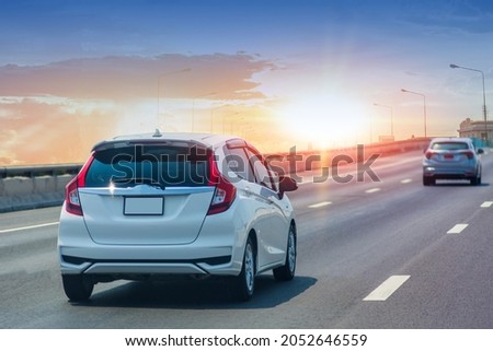 Car Driving on road and Small passenger car seat on the road used for daily trips.Auto car. City Car.
